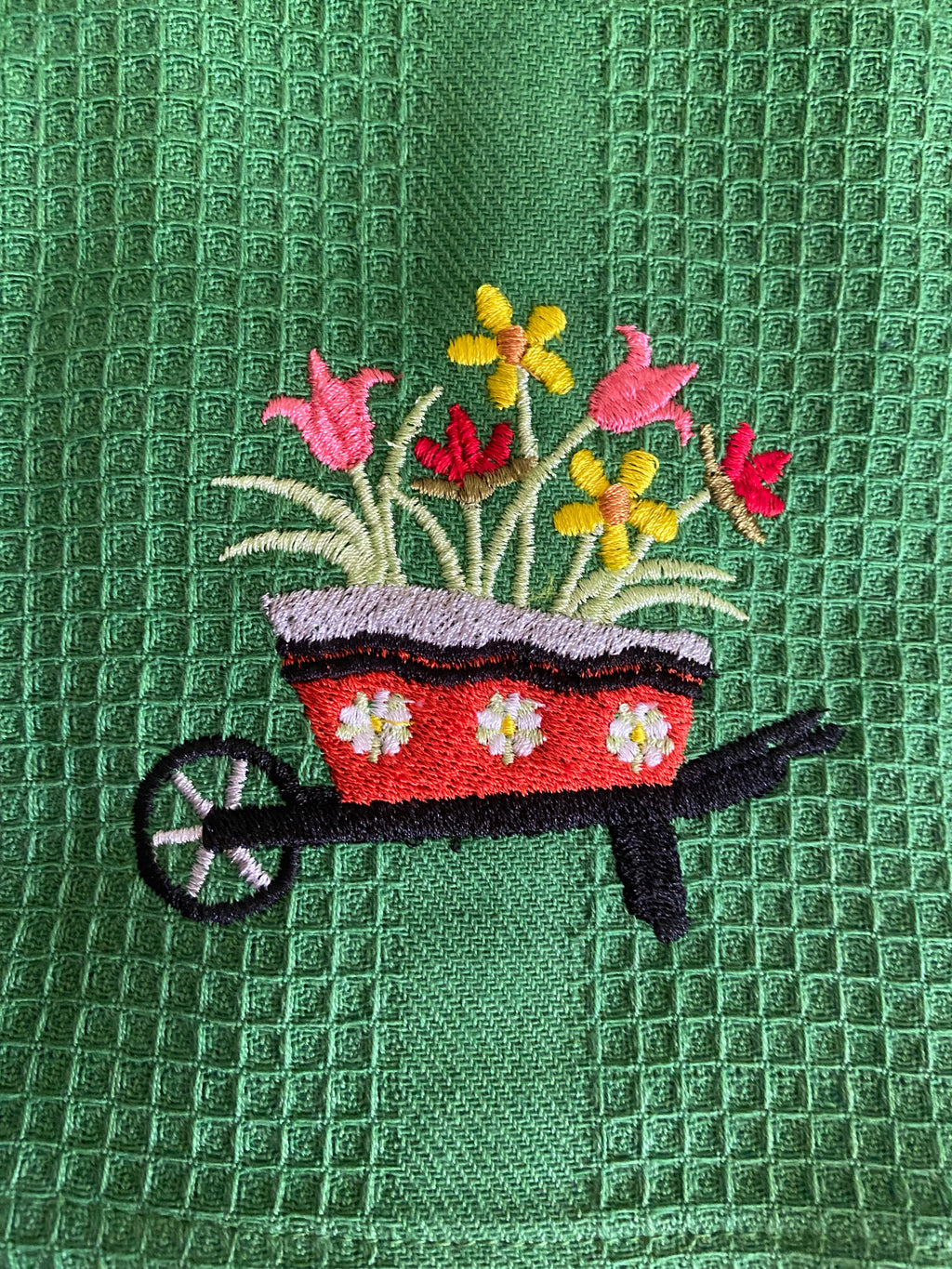 Flowers in a wheelbarrow Kitchen Towel