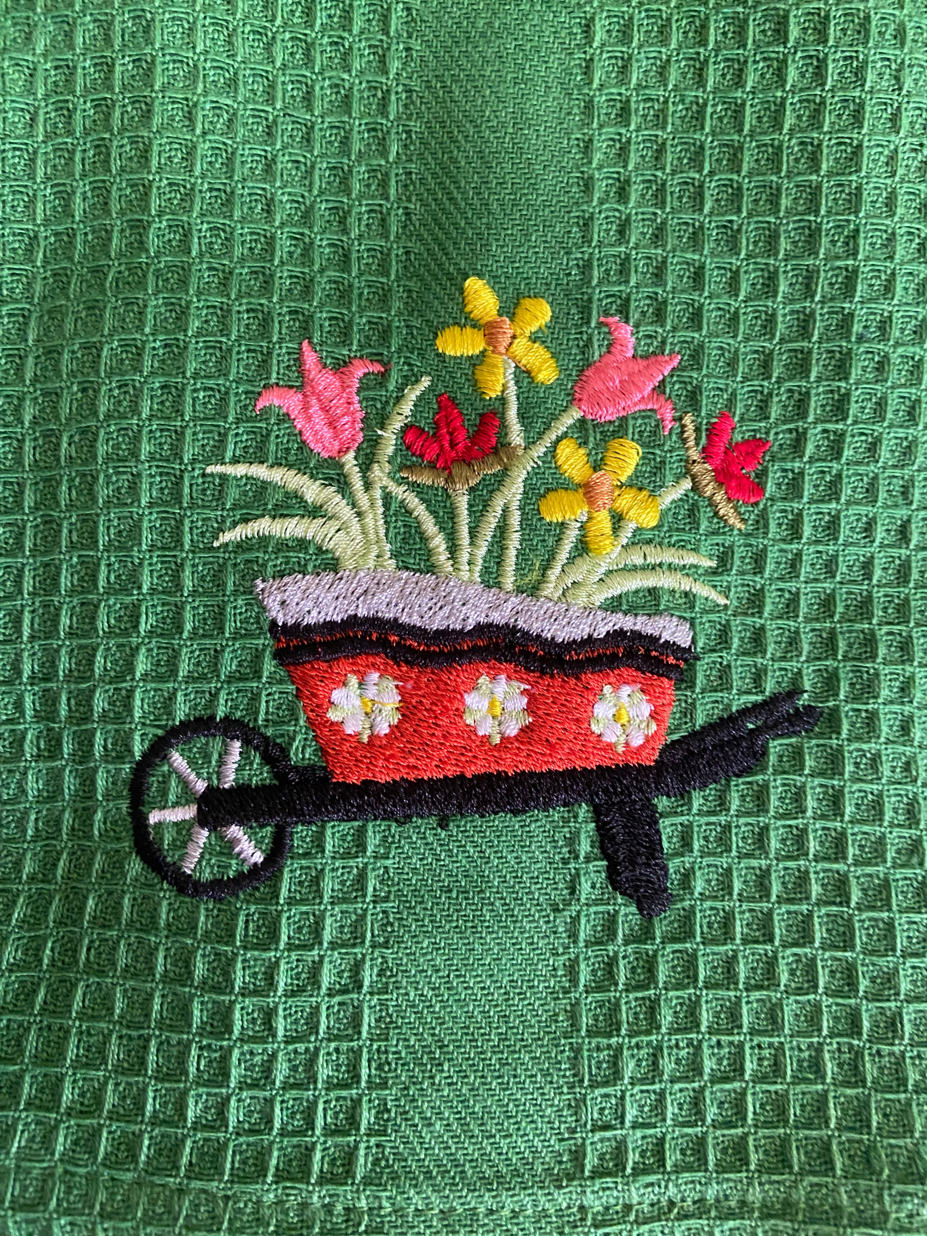 Flowers in a wheelbarrow Kitchen Towel