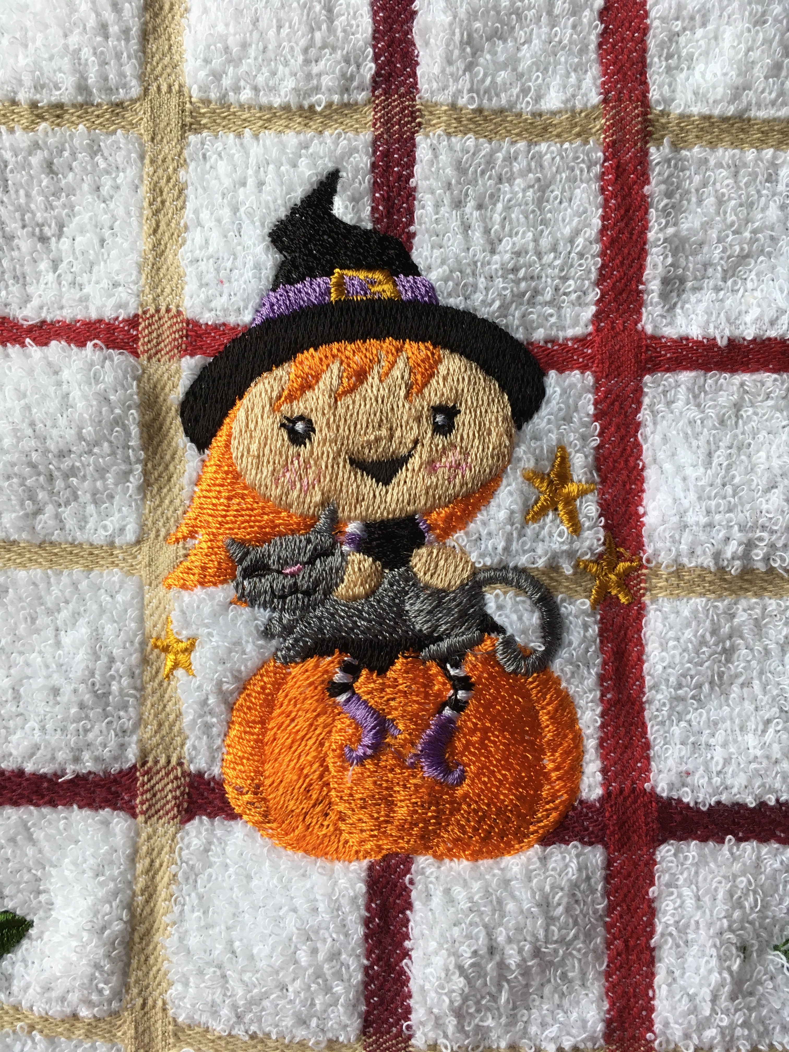 Wanda Witch sits on pumpkin embroidery
