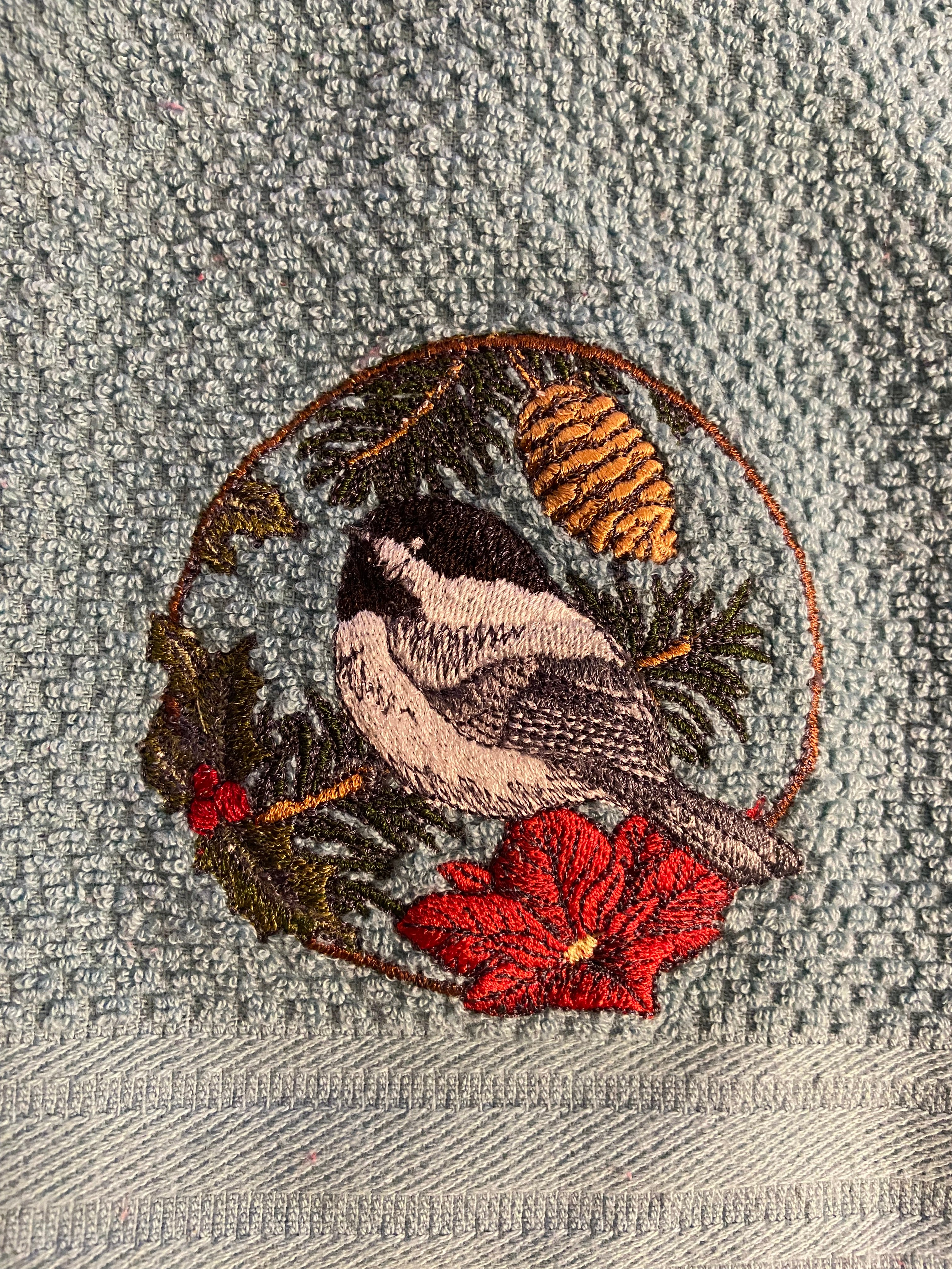 Winter chickadee in circle kitchen towel